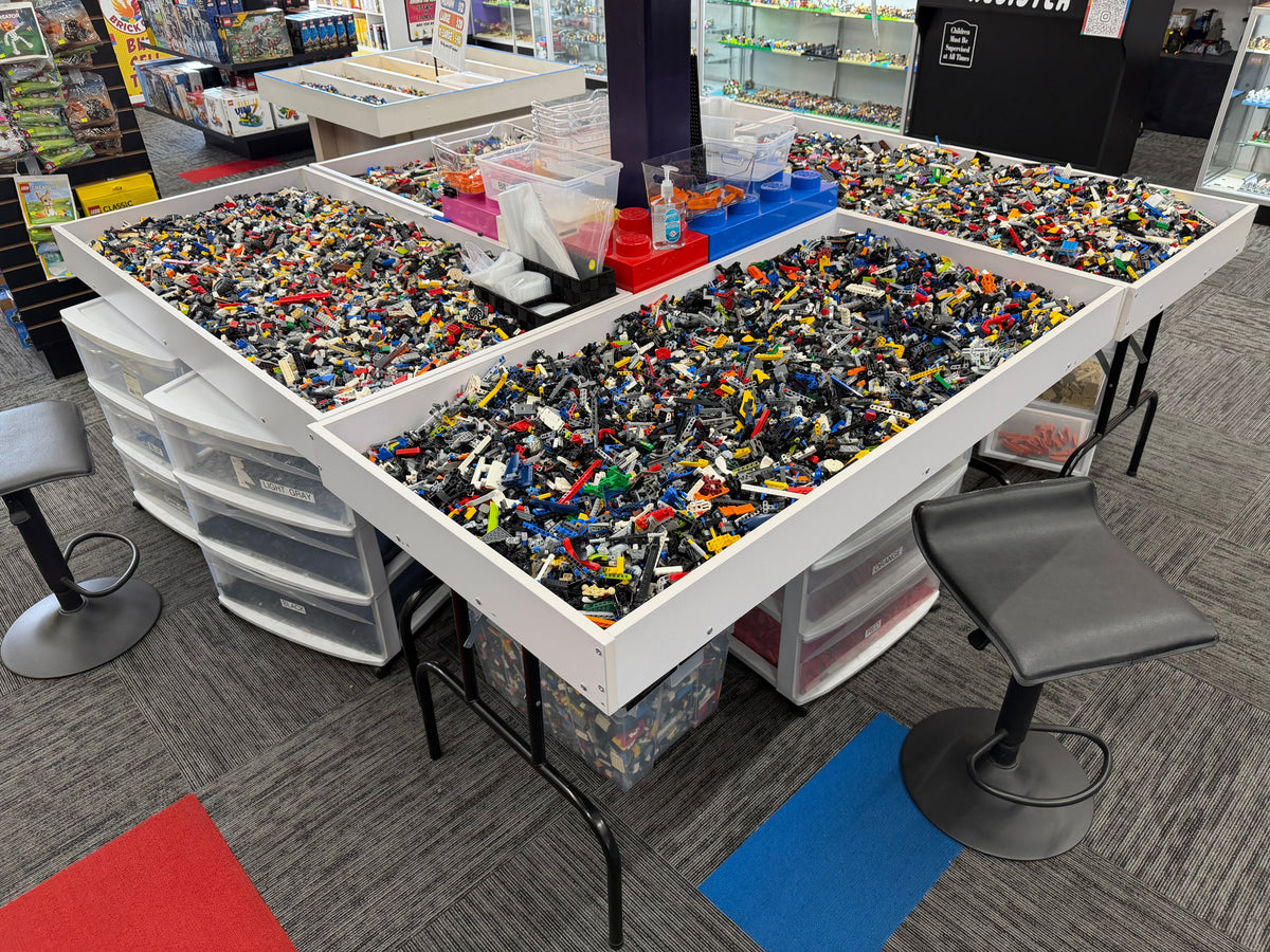 Bulk LEGO bricks by the pound sorted into large open tables at Arizona Brick Co. in Chandler, Arizona