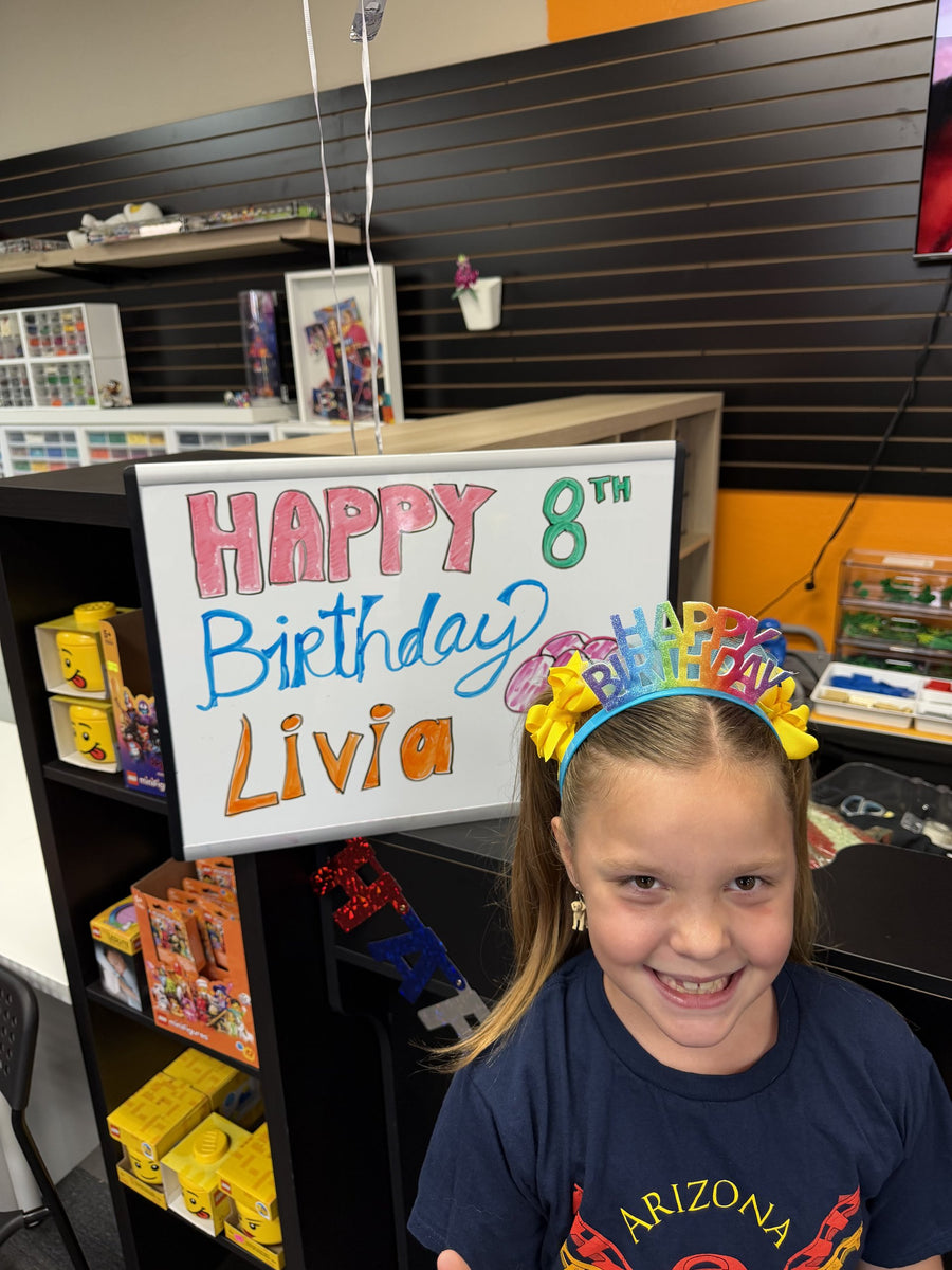 A hand-made Happy Birthday sign on display in the party room