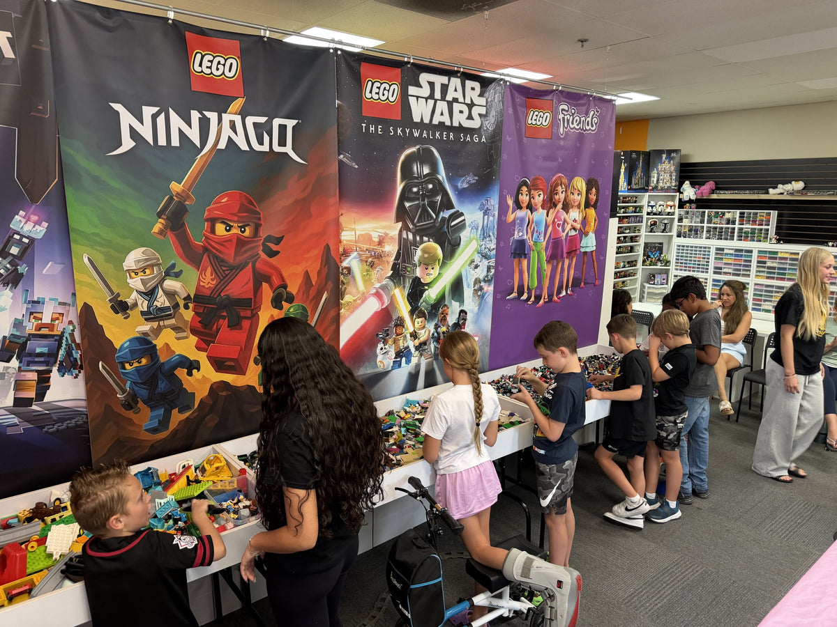Children building at the bulk LEGO tables during a birthday party at the Arizona Brick Co. event space