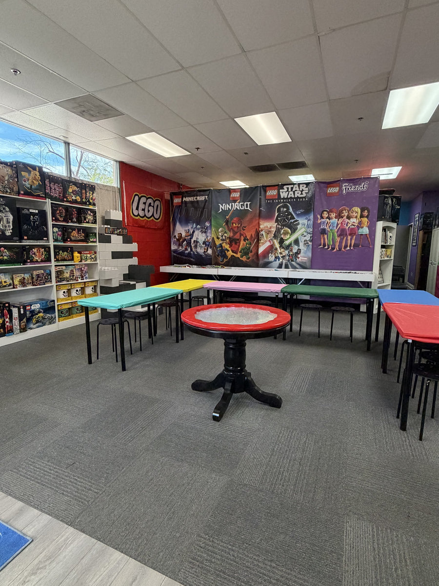 The Arizona Brick Co. party room set up and ready, with colorful tables and the spinner battle table