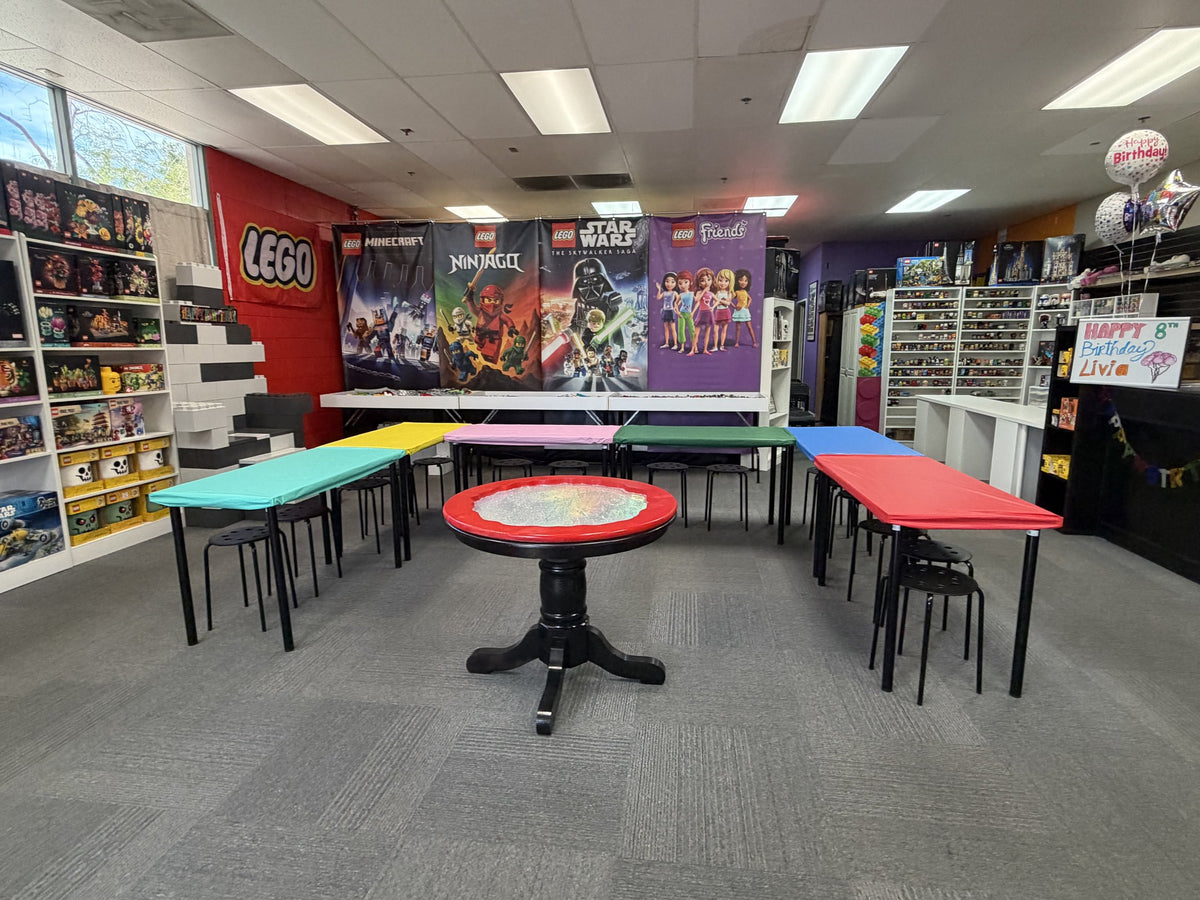 The Arizona Brick Co. event space in Chandler, with colorful build tables and the spinner battle table set up for a party